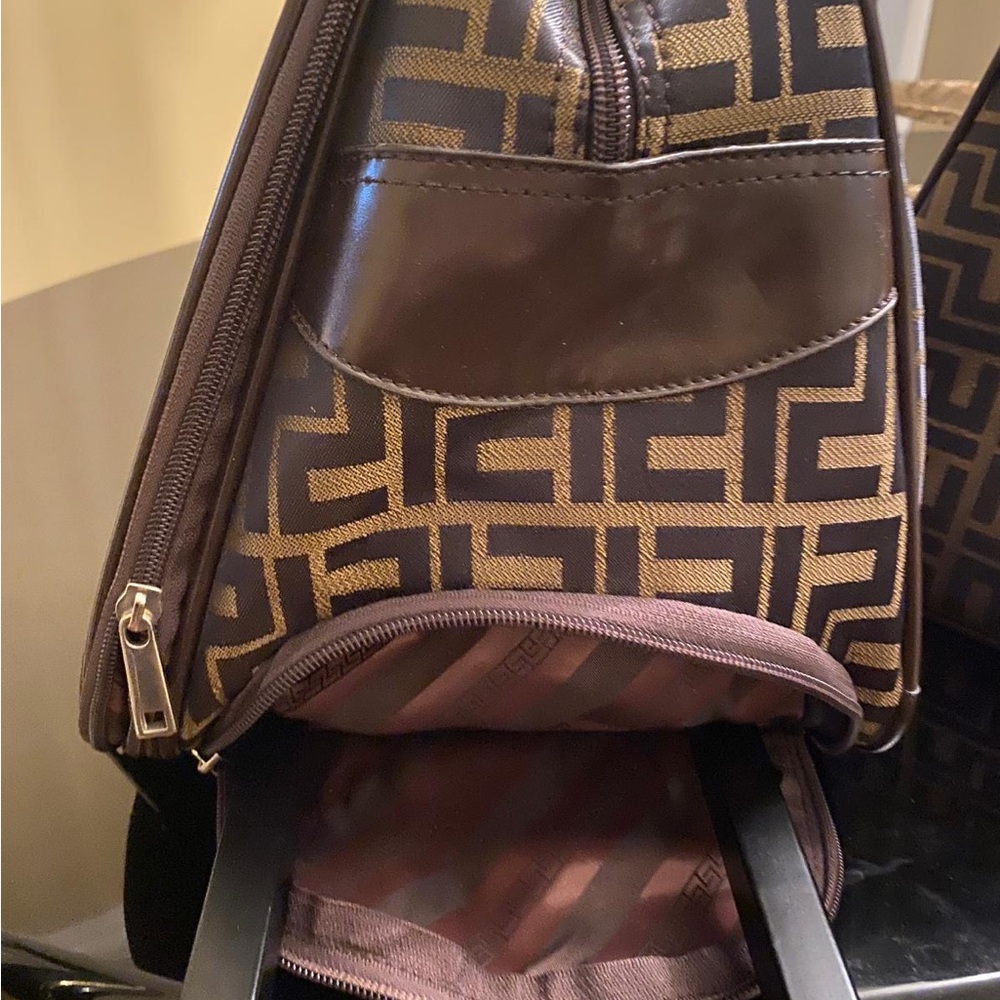 Brown Geometric Pattern bag
With wheels and two compartments